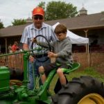 Child riding tractor