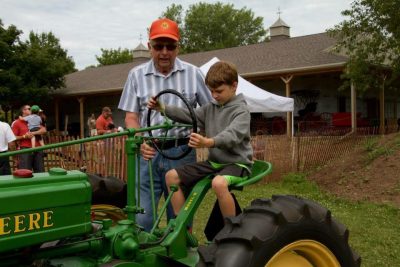 Child riding tractor