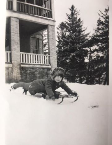 Betty Nelson on a sled winter