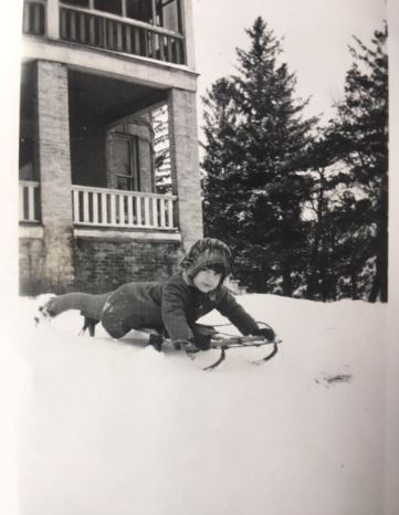 Betty Nelson on a sledding