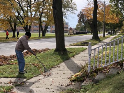 94-year old raking leaves yard