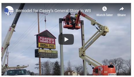 Signage being lifted into place at Casey's General Store