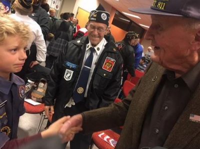 Allan Kieckhafer shaking hands with a scout