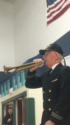 Howard Knox blowing TAPS at Addison Elementary