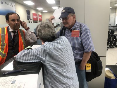 Nancy and David filing claim for lost luggage in San Salvador