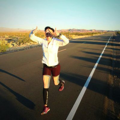 Thabetha Wolfe running in desert