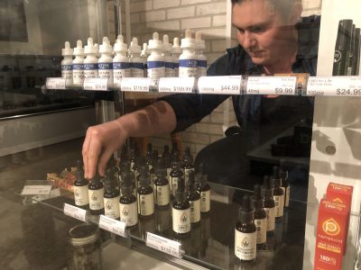Stocking shelves at Cannabis Collective