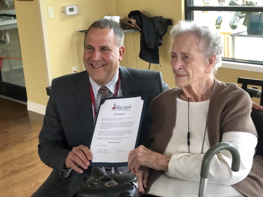 Jay Shambeau presents Doris Yach with proclamation