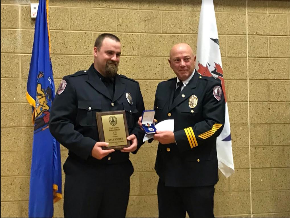 Kyle Knoeck receiving Officer of the Year
