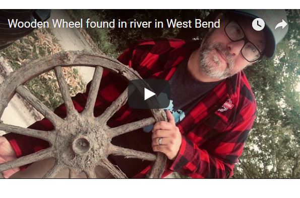 Wooden wheel from river