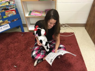 KML reading to a cow on pajama day