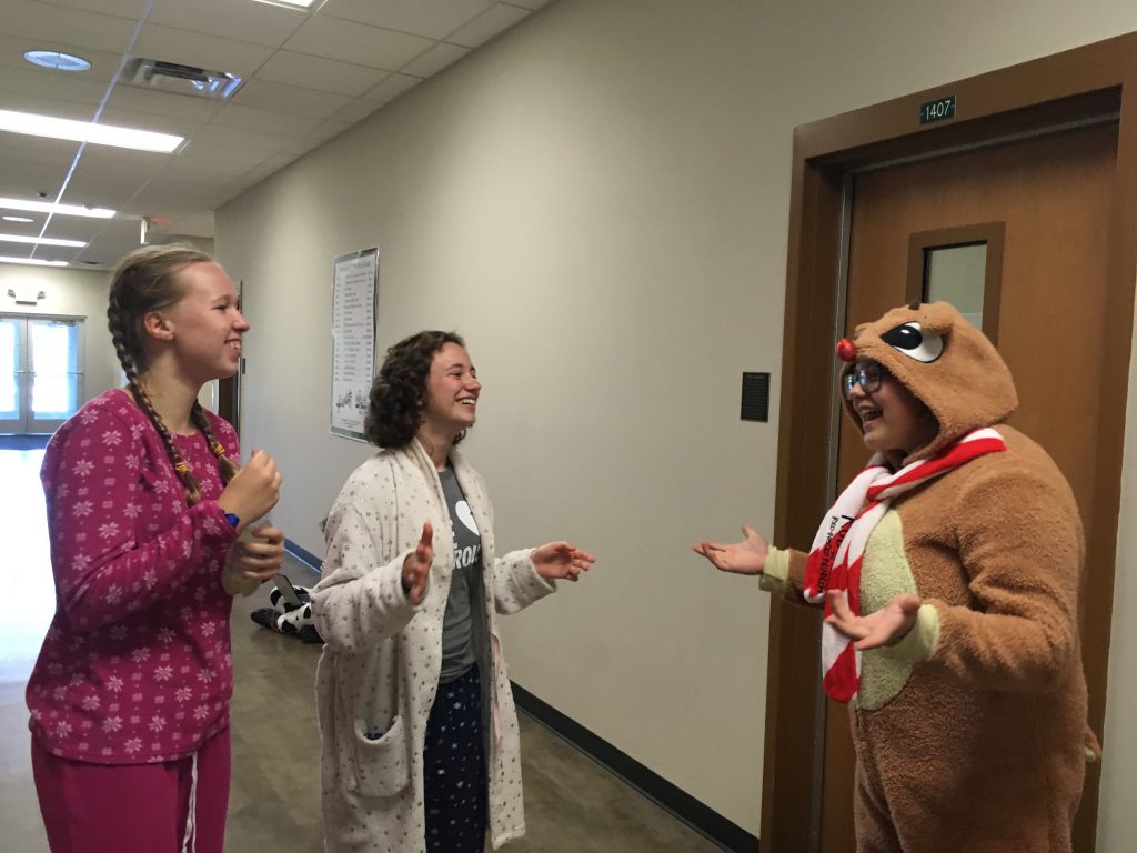  KML senior Grace Biermann and Sophomores Amelia Pfund and Lydia Strey chat in the hallway before play practice during pajama day at KML
