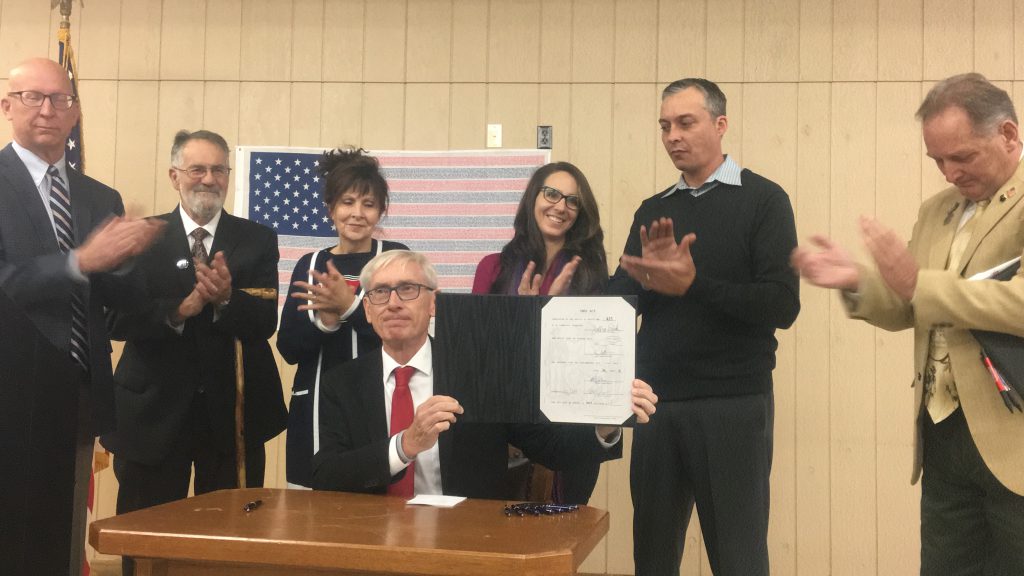 Gov. Evers signing 9/11 Memorial Highway legislation