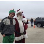 Helicopter grounded by weather but Santa arrives at West Bend Airport | By Ann Bauer Santa arrives at WB Airport