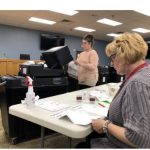 Clerk counting ballot from April 7 election