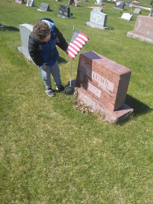Angel placing flag for Memorial Day