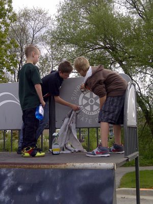 Boys cleaning skate park