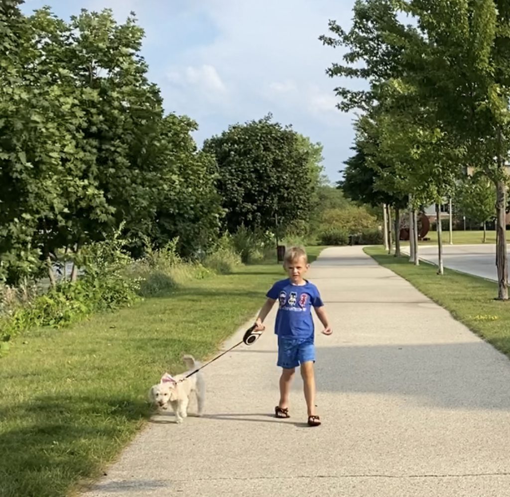 Keegan walking dog by Cast Iron