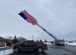 VIDEO | Giant US flag flying in tribute following death of former battalion chief flag