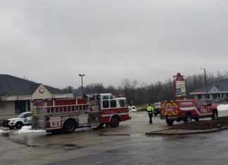 Police on scene and streets blocked at Hwy 33 and Shepherds Drive in West Bend, WI