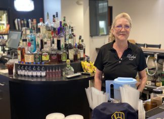 Angela Gonzales has a round of cold drinks waiting at West Bend Lakes Golf Club