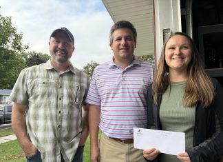 VIDEO | Check presentations to flood families on 16th Avenue in West Bend, WI