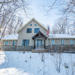 REAL ESTATE | Escape to the Woods: Lodge-style home tucked into West Bend’s snowy landscape | By Emmer Real Estate Group